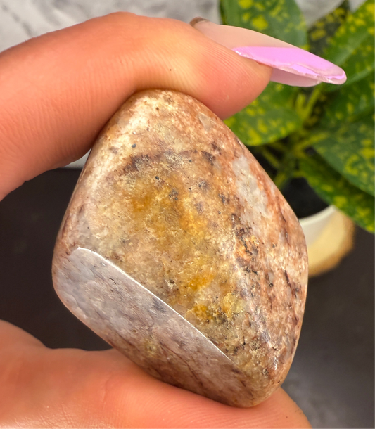 Hand polished sunstone palm stone