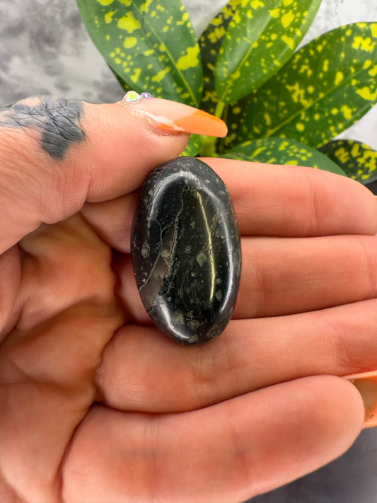 Amygdaloidal basalt (“galaxy stone”) cabochon